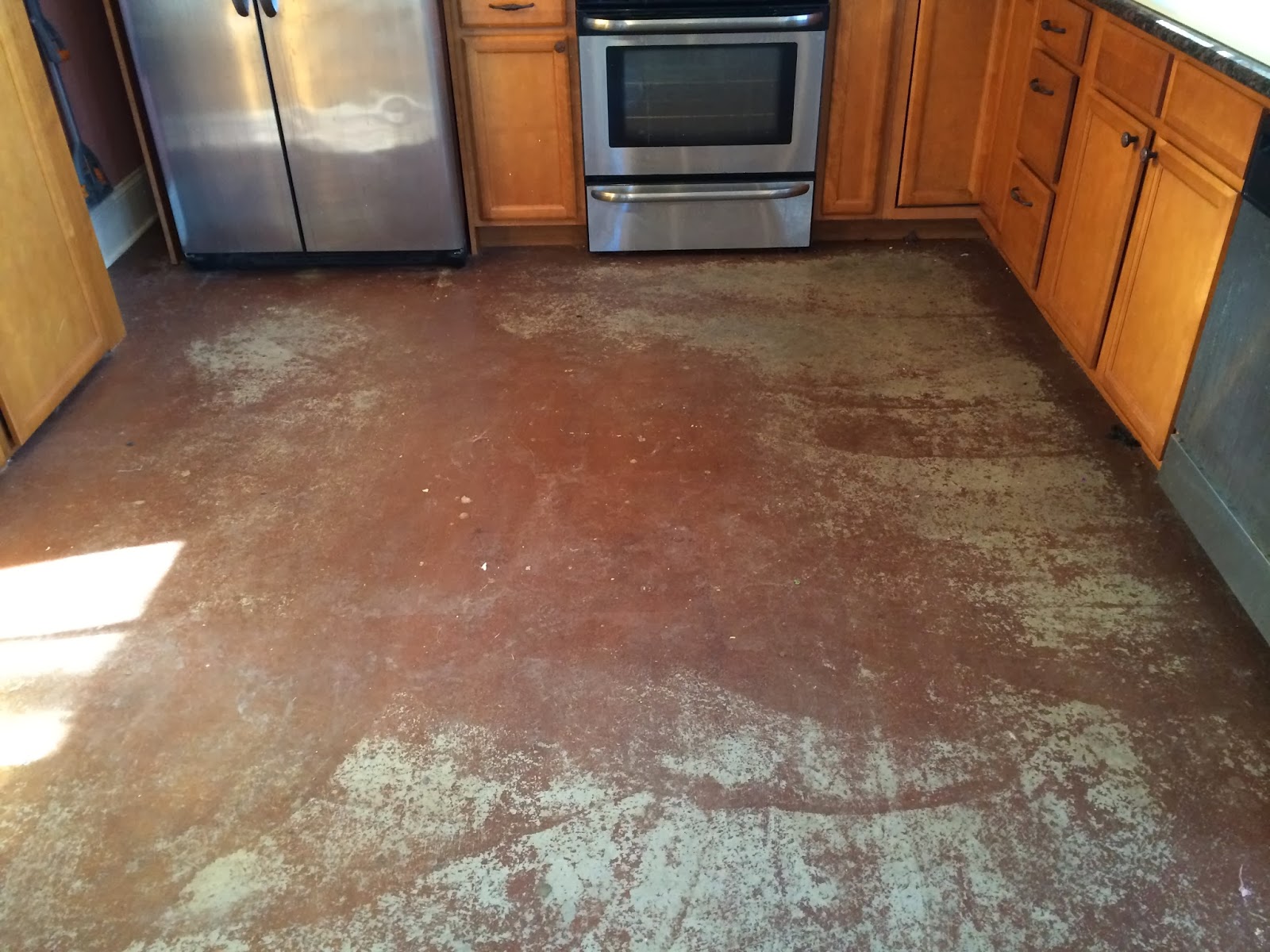 Refinishing stained concrete floors
