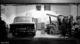 Mercedes-Bens 220S (W111) and bicycle at night