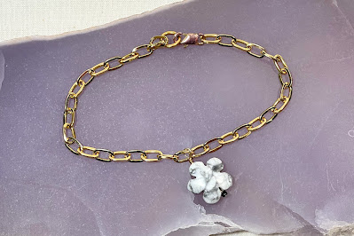 gold chain bracelet with flower charm