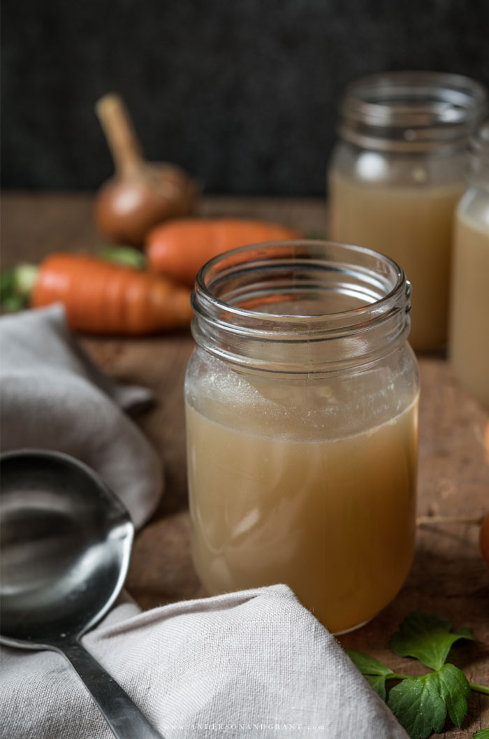 Jars of from-scratch chicken stock made with scraps