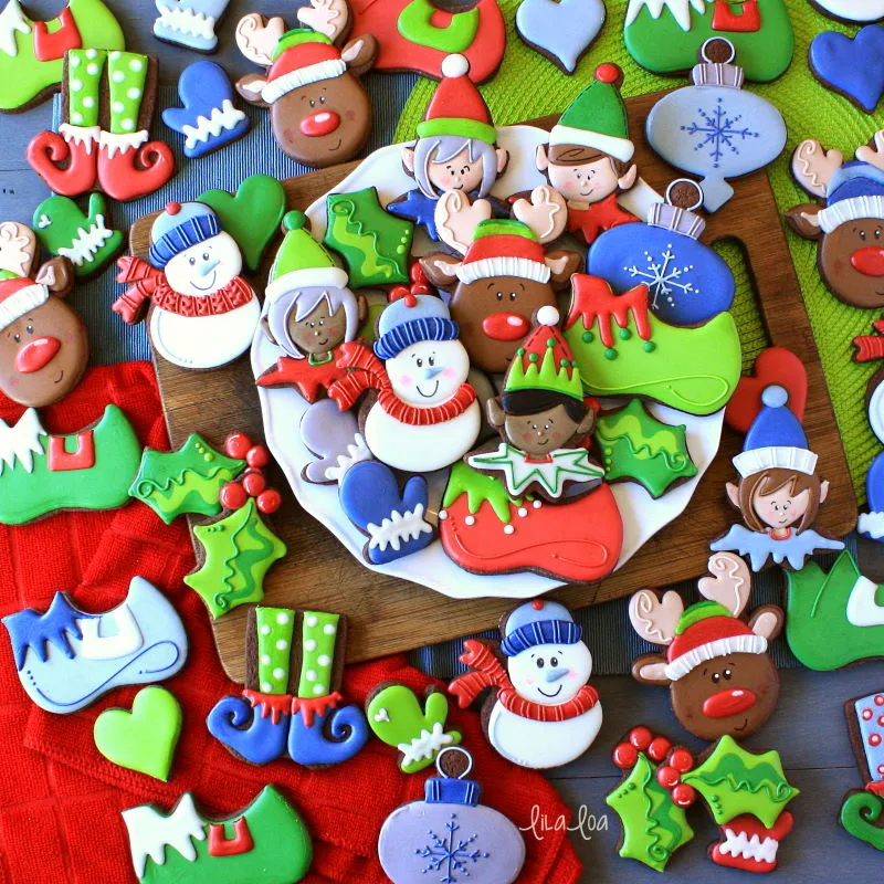 Brightly colored and fun Christmas sugar cookies - snowman, elves, holly, and reindeer