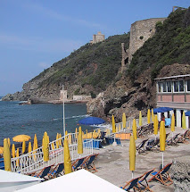 A beach on the rocky waterfront at the seaside village of Quercianella