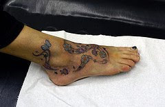 flowers on foot tattoo