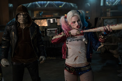 Image of Margot Robbie and Adewale Akinnuoye-Agbaje in Suicide Squad