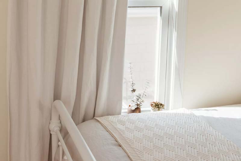 9 Ways to Warm Up the Bedroom Without Running the Heat