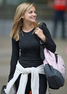 Jennifer Katharine Gates in black dress with shopping bag