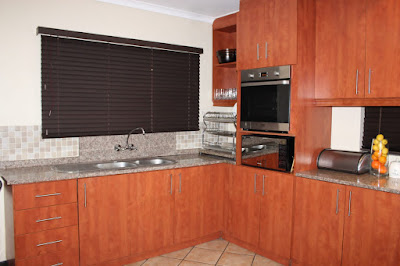 large kitchen with tiled floors