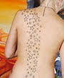 star tattoos on girls back body 