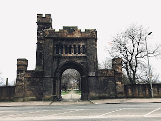 A photo of a castle like old stone building with towers - the gate house to the Southern Necropolis.  Photograph by Kevin Nosferatu for the Skulferatu Project.