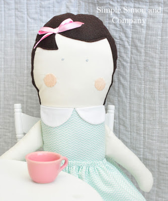 Cloth Doll with embroidered face and felt hair seated