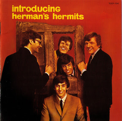 Herman's Mermit single cover for "I'm Into Something Good" read backgraound yellow lettering
