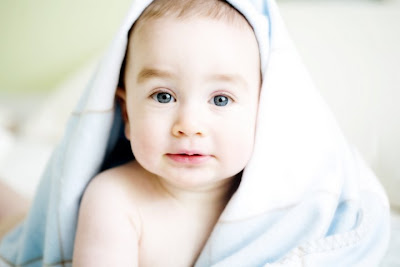 Baby with smudgy blue eyes