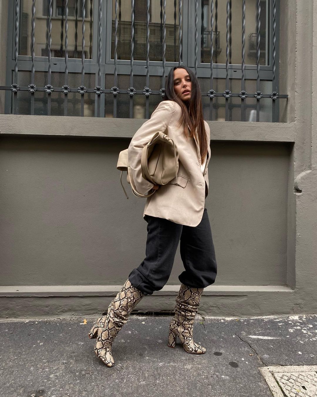 18 Best Animal Print Boots to Shop for Fall and Winter — @sarahbrezel in an oversized blazer, baggy jeans, and snake-print knee-high boots