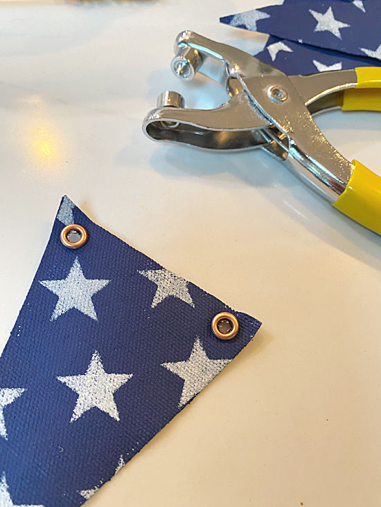 copper grommets on blue starred flags