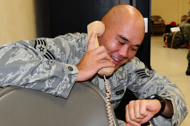 Staff Sgt. Thomas Agee, 554th RED HORSE Squadron structural journeyman, calls home from the mobility deployment processing center here Oct. 5 before departing to Indonesia to assist in providing aid to victims after a 7.6 magnitude earthquake struck West Sumatra province on Sept. 30.