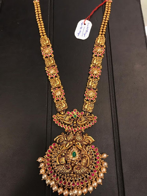 Trendy Antiqye haar with Red Kundan