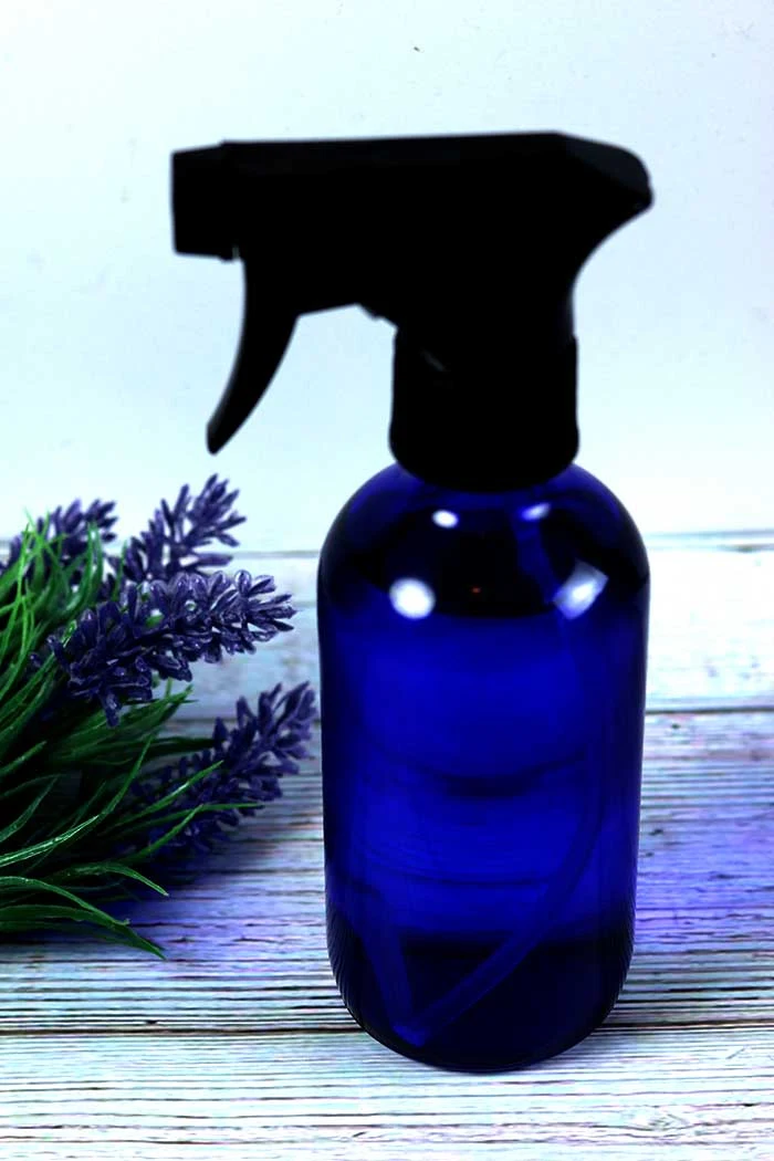 How to make a magnesium oil spray recipe. This natural remedy has many benefits for your skin, eczema, for migraines, for pain, and for sleep.  This easy DIY has only two ingredients plus essential Learn the best application and where to apply it and how to use it.  This is for kids and adults with a kid safe essential oil blend. Learn about the side effects, too.  Don't want to DIY?  Find out where to buy. #magnesiumoil #diy #essentialiols #magnesiumspray
