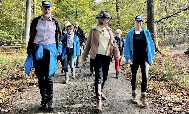 Queen Mathilde wore a Sherpa camel jacket by Attic and Barn. Chloe Eria sunglasses. Penelope Chilvers long tassel boots