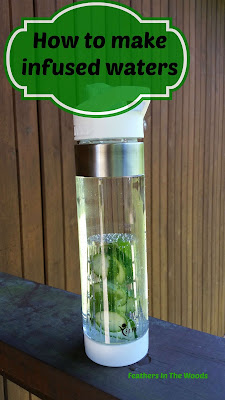 water bottle with fruit and herbs, making infused water