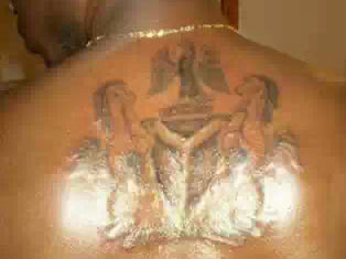 PICTURE : Man Tattoo Nigeria Coat Of Arms On His Back