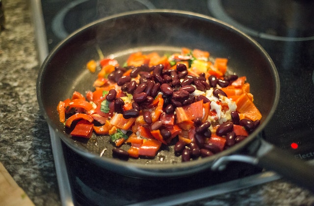 Red beans cooked in a pan with other veggies