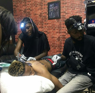 Man Gets Wizkid And Davido Face Tattooed On His Back (Photos) 