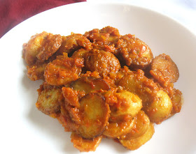 Crispy Potato Slices in a Spanish Chili Tomato Sauce