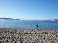 Person alone watching across English Bay