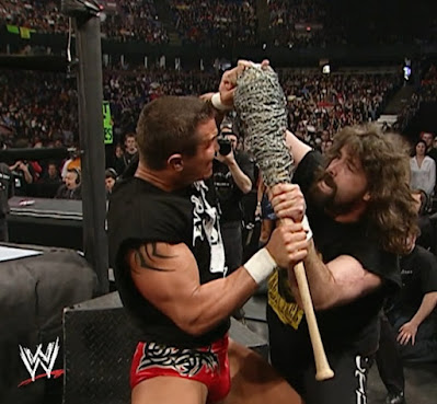 WWE Backlash 2004 - Mick Foley and Randy Orton battle over a barbed-wire baseball bat