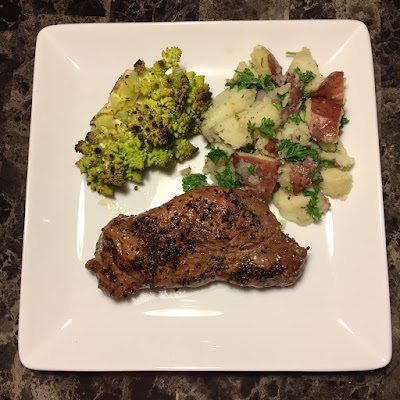 Grass fed NY strip, grilled romanesco and parsley buttered red potatoes