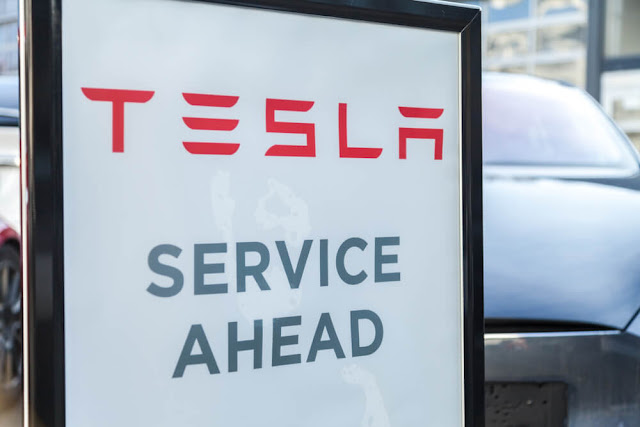 Tesla Service Center Sign at a Car Dealer