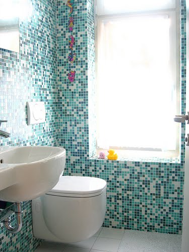 Small Bathroom Tiles Tile work gives this bathroom an ultra-modern look