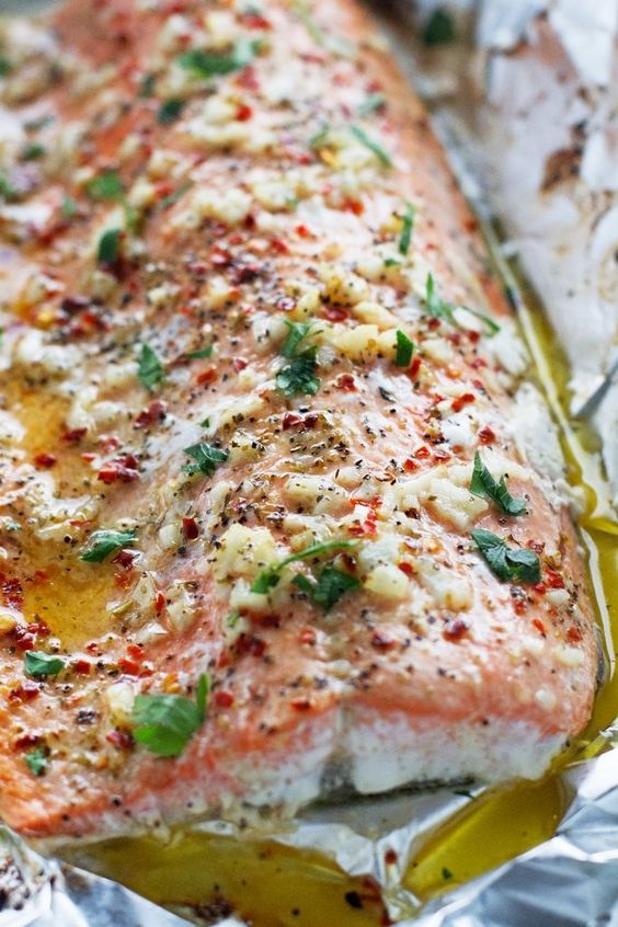 Baked salmon in foil that’s been brushed with my lemon garlic butter sauce