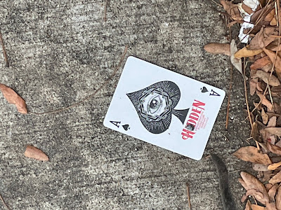 Card on the sidewalk, Ace of Spades