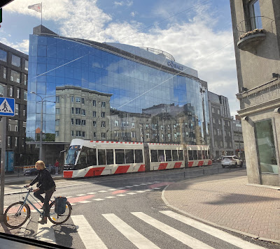 reflection of a streetcar on a building window in Tallin, Estonia