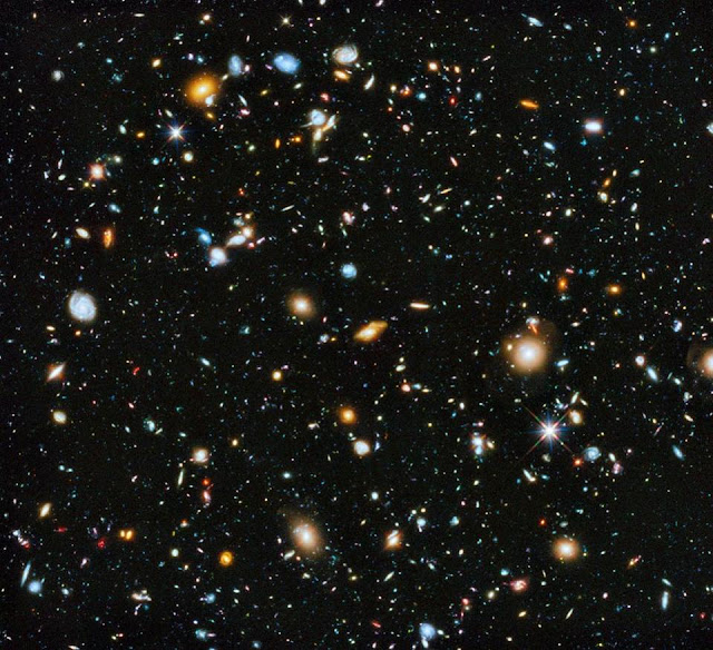 hubungan-antara-alam-semesta-luas-dengan-partikel-terkecil-kosmos-astronomi