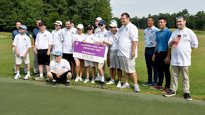Members of the Hockomock Area YMCA unified golf team are pictured at the clinic with Don Baldassare, Head Golf Professional at TPC Boston, along with members of the TPC professional golf staff and YMCA volunteer Sophie Scott. L-R, the golfers include: Dan Deschenes, Brian Santos, Daniel Bortolotti, Mike McCarthy, Doug McNulty, Matt Cobb, Jaci Ehrlich, Kevin Leary, Liam Farley, Tim Paquin, Ben Ragazzo, Kevin Prior and Dillan Murphy.