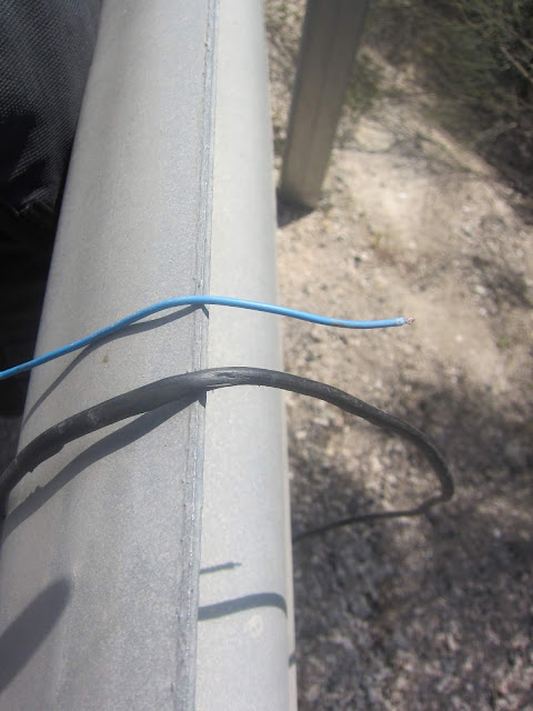 cutting wire on the roadside