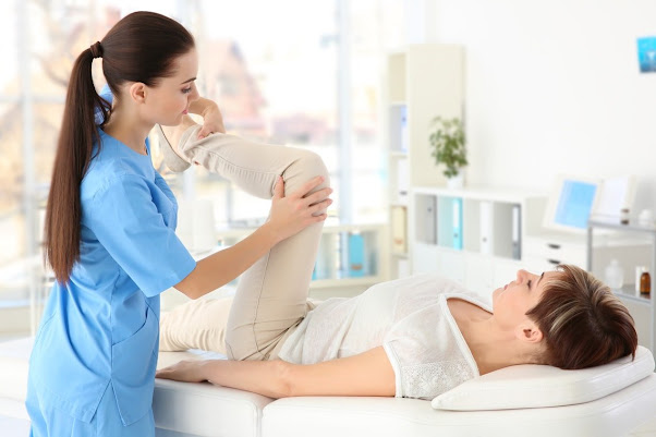 Physiotherapist attending to patient personal treatments