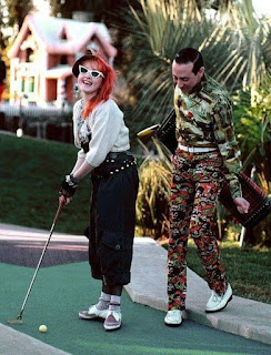 Cyndi Lauper playing mini golf with Pee Wee Herman.
