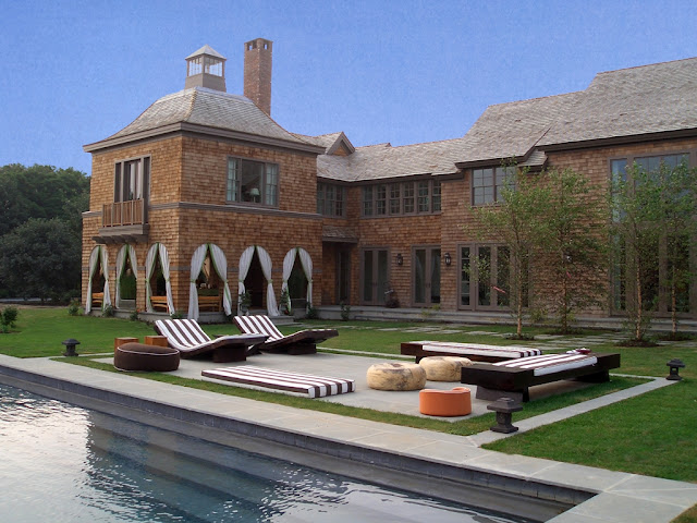 Photo of cottage and the pool in the backyard as seen from the pool area