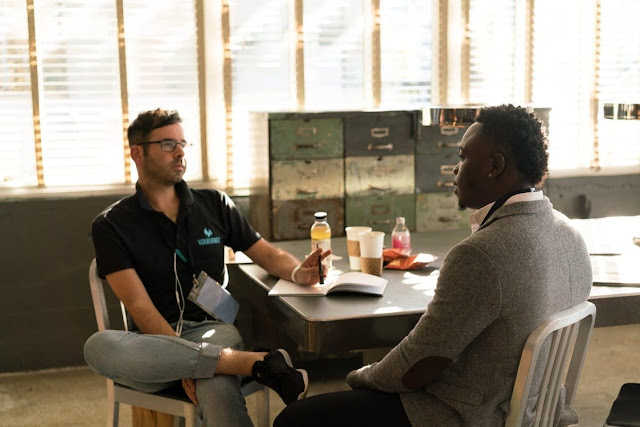 Two people talking in a business setting