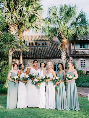 bridesmaids in shades of green long dresses