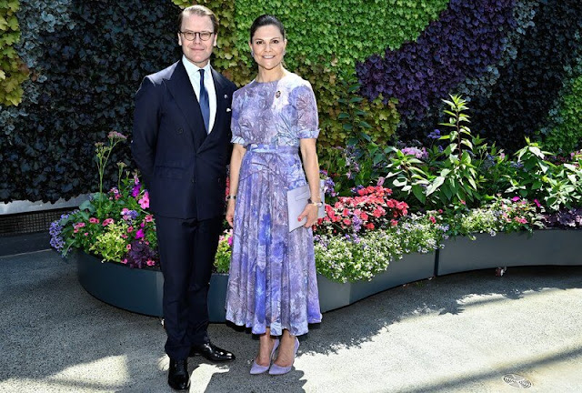 Crown Princess Victoria wore a belted short sleeve blazer by Sandro, and a bespoke purple floral print dress