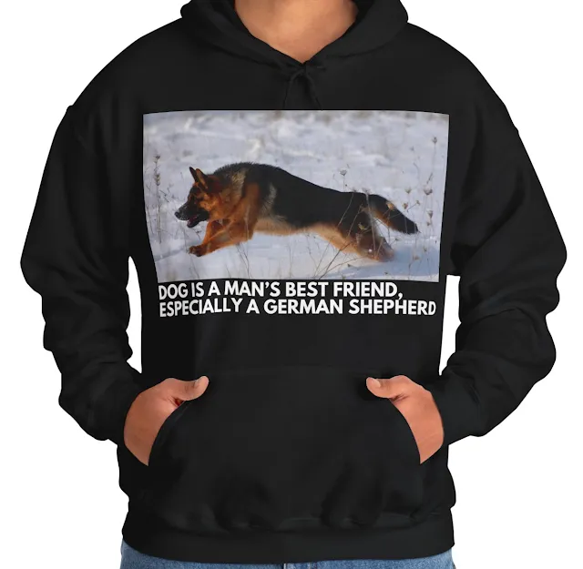 A Hoodie With Huge Red and Black German Shepherds Jumps On the Snow and Caption Dog is Man's Best Friend