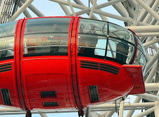 the red car london eye ferris wheel