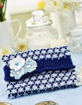 http://www.letsknit.co.uk/free-knitting-patterns/clutch-purse