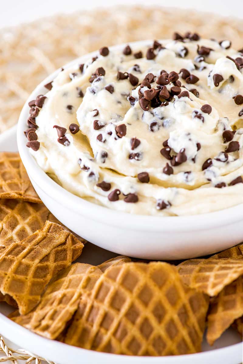 Cannoli Dip! An easy cannoli dip, mixed with delicious mini chocolate chips and served with broken waffle cones for dipping.