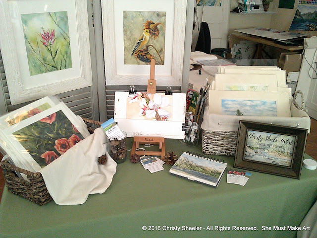 Giclee art prints, framed originals, a work in progress, my sketch book, and originals with mats.