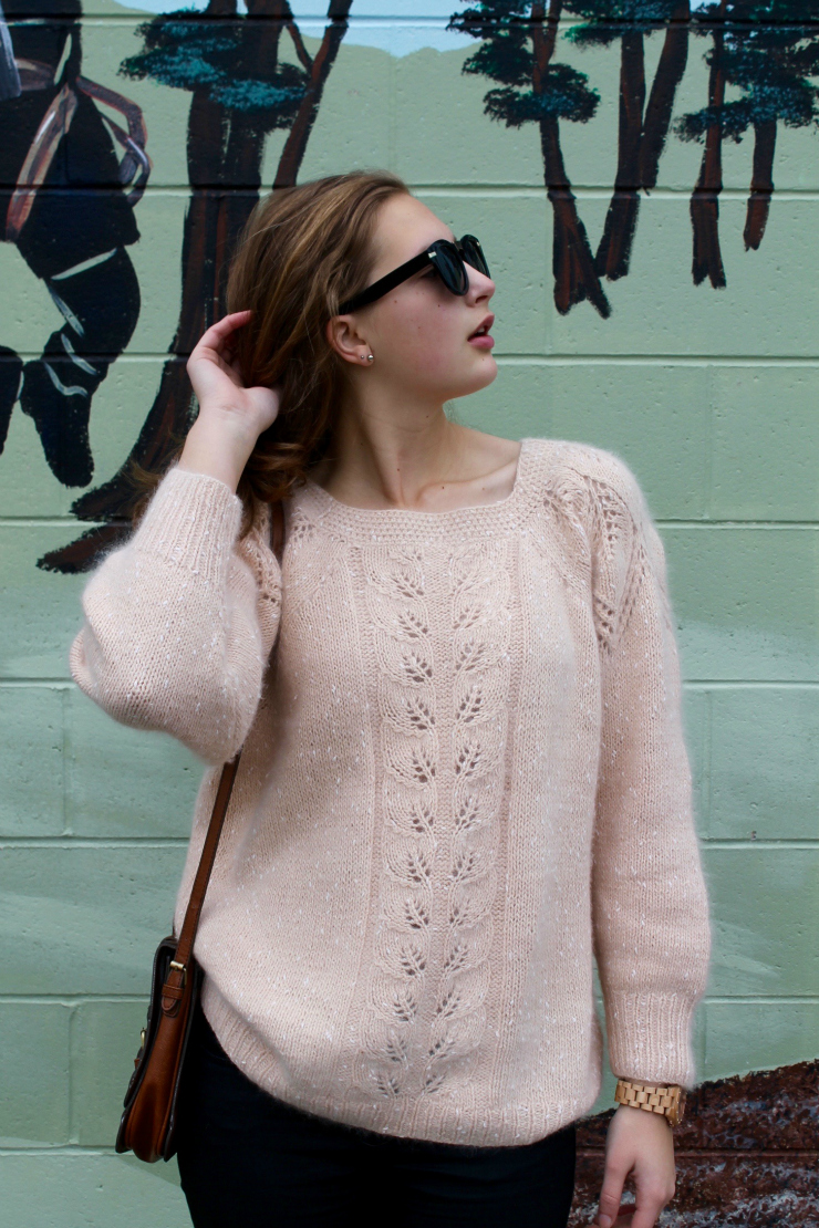 Peach colored angora sweater, black skinny jeans and classic woooden watch